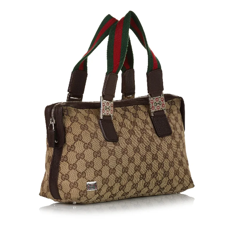 Women Gucci bags with a snap - button closure and a decorative charmGucci GG Canvas Web Handbag (34424)