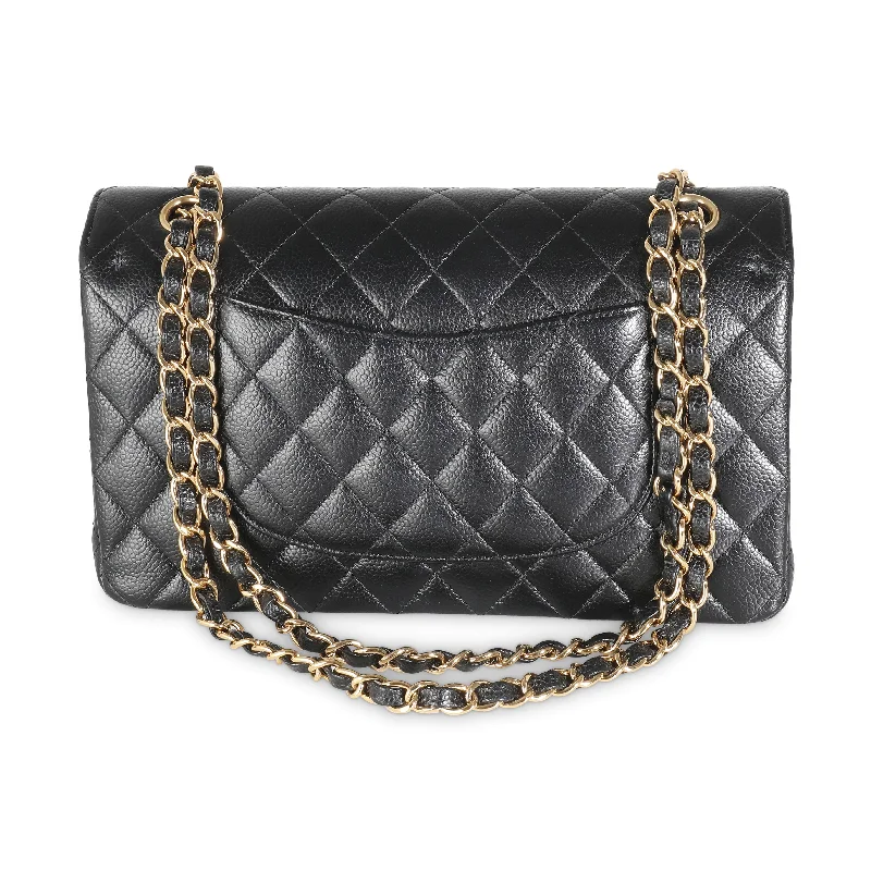 Chanel bags with iconic gold chainsCHANEL Black Quilted Caviar Medium Classic Double Flap Bag