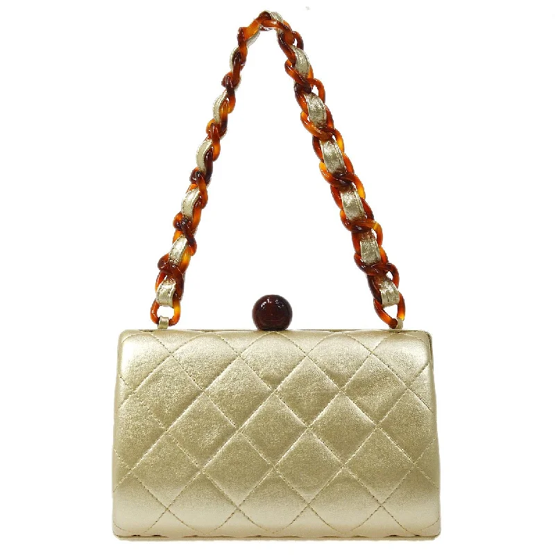 Chanel bags for women who love timeless fashionCHANEL 1996-1997 Gold Lambskin Kisslock Handbag