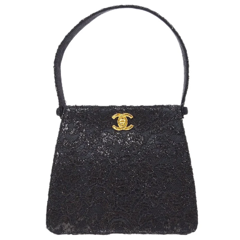 Chanel bags with iconic gold chainsCHANEL 1997-1999 Double Sided Turnlock Handbag Black Satin