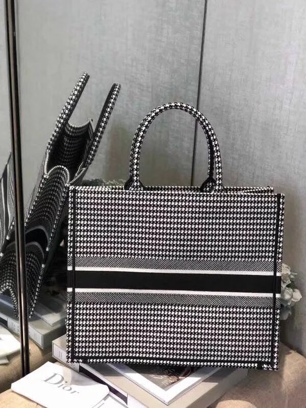 Christian Dior Saddle bags with a studded trim for a bold lookChristian Dior Book Tote Bag In Houndstooth Embroidered Canvas