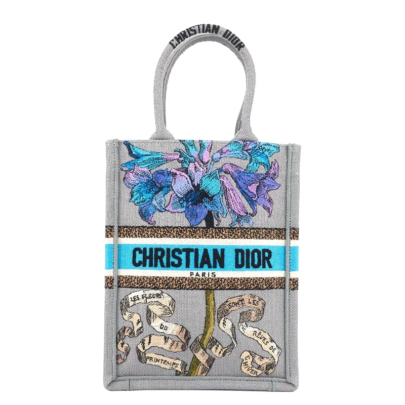 Christian Dior backpacks with a sleek, minimalist silhouetteDIOR Book Tote Mini Canvas Phone Bag