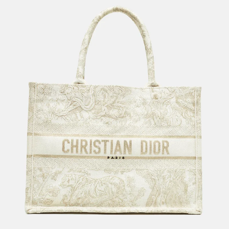 Christian Dior backpacks with a sleek, minimalist silhouetteDIOR Gold/White Toile De Jouy Embroidered Canvas Medium Book Tote