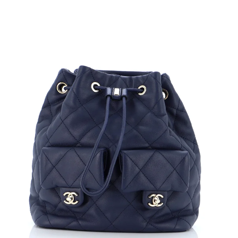 Christian Dior Saddle bags with a studded trim for a bold lookDouble Pocket Drawstring Backpack Quilted Calfskin Small